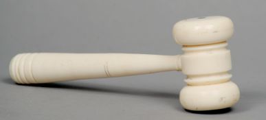 A carved ivory gavel
Of typical form.  16.5 cms long.   CONDITION REPORTS:  Generally in good
