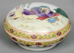 A small Chinese porcelain box and cover
The removable domed circular lid painted with a resting