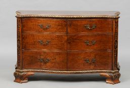 An 18th century style walnut serpentine commode, in the manner of Gillows
The shaped top above a