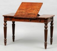 A 19th century mahogany writing table, in the manner of Gillows
The rounded rectangular top with a