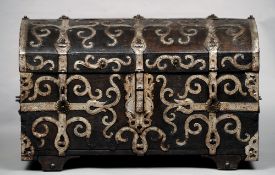 A 16th century German oak coffer
The domed body mounted with ornate scrolling silvered iron