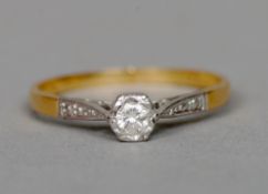 An 18 ct gold platinum and diamond solitaire ring
The central stone illusion set.   CONDITION