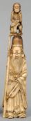 A Japanese ivory okimono
Carved as Jurojin with a monkey on his head; together with a Japanese ivory