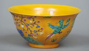 A Chinese yellow ground bowl
With tubular animal and foliate decoration, the underside with six