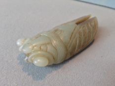 A Chinese carved jade cicada
Of typical form.  9 cms long.   CONDITION REPORTS:  Generally in good