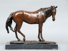 A patinated bronze model of horse
Naturalistically modelled, standing on a black marble plinth base.