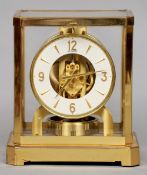 A lacquered brass cased LeCoultre Atmos clock
Of typical form, the white dial with Arabic numerals