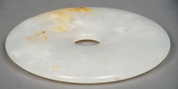 A Chinese mutton fat jade disc
Of circular form with a central hole.  20 cms diameter.   CONDITION