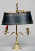 A gilt metal candle lamp
With scroll cast twin adjustable branches and painted tole ware