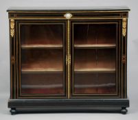 A Victorian ormolu mounted ebonised side cabinet
The bead mounted moulded rectangular top above