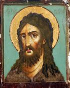 A Russian painted icon of Christ
Polychrome painted on canvas laid on panel.  42 x 52 cms.