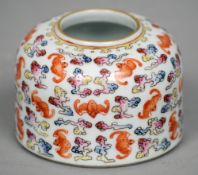 A 19th century Chinese porcelain ink pot
The domed body decorated with bats amongst clouds, the