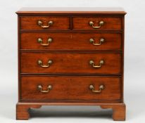 A George III mahogany chest of drawers
The moulded rectangular top above two short and three long