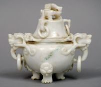 A Chinese mutton fat jade censor and cover
The removable cover headed with a dragon, above the