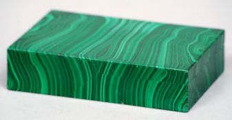An early 20th century unmarked silver mounted malachite cigarette box
Of plain hinged rectangular