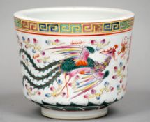 A small Chinese porcelain jardiniere
The Greek key border above the main body decorated with a