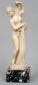 A 19th century carved alabaster figurine
Modelled as a semi-dressed classical maiden, standing on