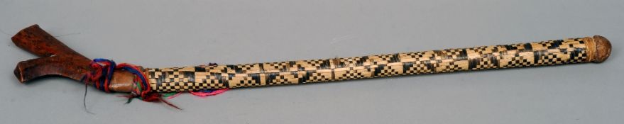 A 19th century Fijian Kia Kava 
Of typical form with woven shaft sheath.  92 cms long.   CONDITION