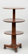 An early 19th century mahogany metamorphic dumb waiter
The moulded circular top extending to