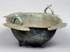 A large Seljuk bronze bowl, Khorasan, probably 11th/12th century
The twin handled vessel with four