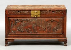 A 19th century Chinese carved hardwood trunk
Decorated with panels of figures and pagodas amongst