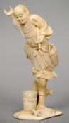 A 19th century Japanese carved ivory okimono
Formed as a fisherman balancing on one foot, the