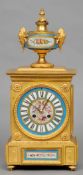 A 19th century Sevres type porcelain inset ormolu cased mantel clock
The painted dial with Roman
