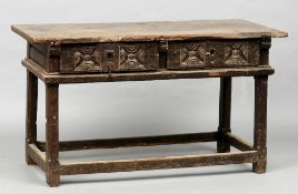 An 17th/18th century Spanish oak and walnut side table
The single plank top above two panelled