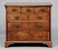 An 18th century walnut chest of drawers
The moulded rectangular top above an arrangement of three
