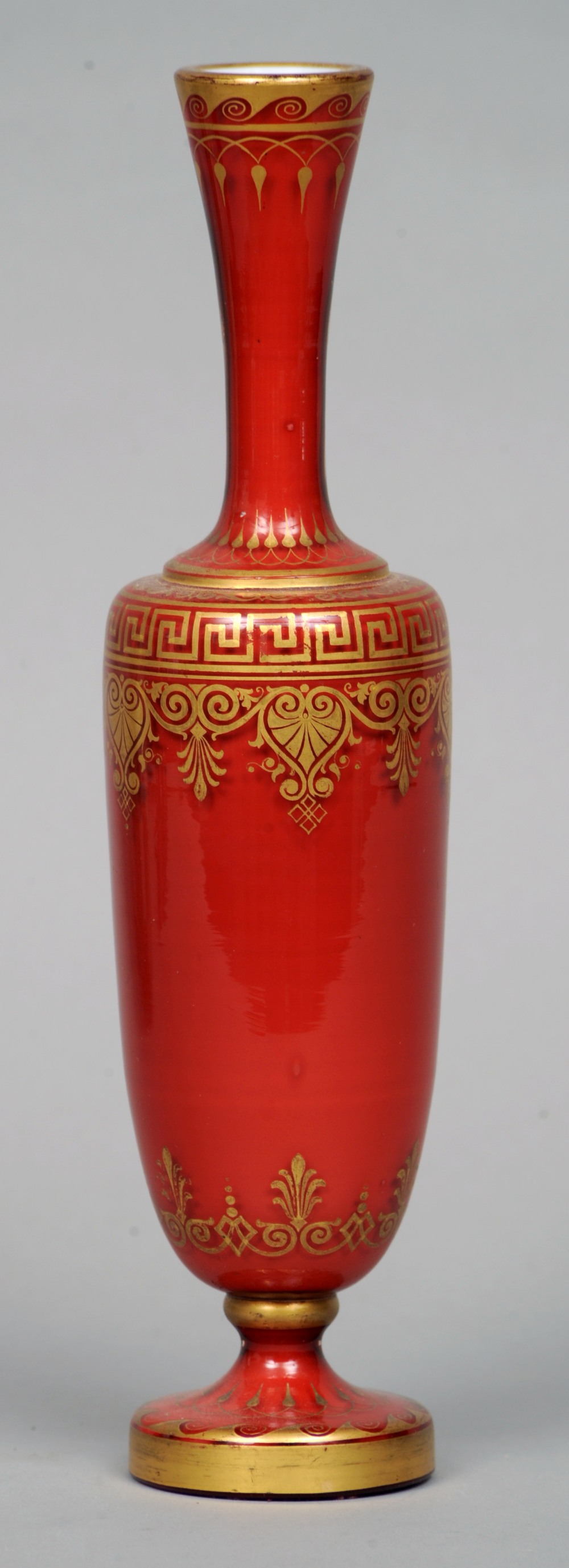 A 19th century Continental clear cased red glass vase
The tall neck, slender body and spreading foot