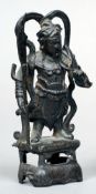 A Chinese bronze figure
Modelled as a warrior, standing on a pierced plinth base.  16 cms high.