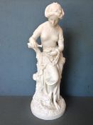 A Minton Parian figure 
Modelled as a semi-clad classical maiden filling an oil lamp, impressed