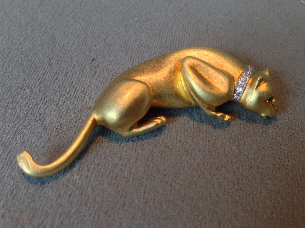 An unmarked high carat gold panther form brooch
Naturalistically modelled wearing a diamond set