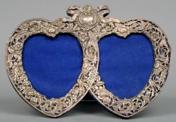 A pierced silver double heart shaped photograph frame, possibly hallmarked Birmingham 1899, maker'