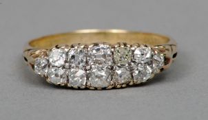 An Edwardian 18 ct gold diamond set ring
Of navette form with chased shoulders.   CONDITION REPORTS: