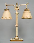 A painted tole ware table lamp, possibly American
With twin branches and shades with painted bands.