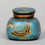 A 19th century cloisonne inkwell 
With hinged lid and white porcelain insert, the main body