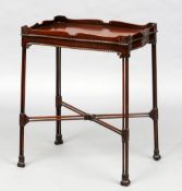 An 18th century style mahogany silver table
The shaped galleried top above a serpentine frieze,