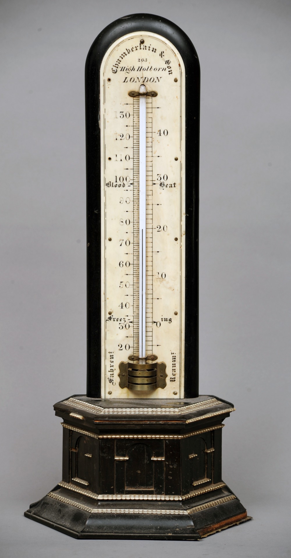 A 19th century ivory mounted ebonised desk top thermometer
The vertical ivory scale signed