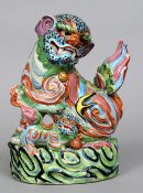 An 18th/19th century Chinese porcelain dog-of-fo group
The brightly enamelled beasts in typical