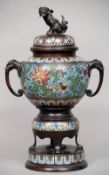 A late 19th/early 20th century cloisonne decorated patinated bronze koro
The domed lid surmounted