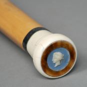 A Victorian ivory handled malacca walking stick
The handle inset with a jasper ware plaque and a