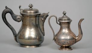 A 19th century Continental silver miniature teapot
With engraved decoration and initialled