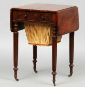 An early 19th century mahogany Pembroke work table
The rounded twin flap top above a frieze drawer