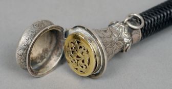 A 19th century unmarked white and gilt metal mounted riding crop
The finial comprising a lidded