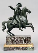 A 19th century patinated bronze model of Napoleon
Modelled astride his rearing mount, standing on