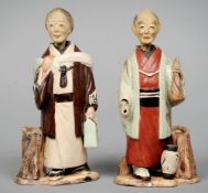 A pair of Japanese pottery nodding figures
Modelled as a man and wife in traditional costume.  16.