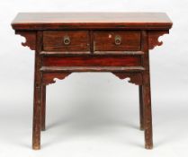 A 19th century Chinese side table
The cleated rectangular top above two drawers with drop handles