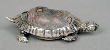 An Edwardian silver pin cushion, hallmarked Birmingham 1906, maker's mark of CS FS
Formed as a