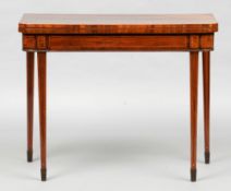 A 19th century mahogany card table
The hinged rounded rectangular top enclosing a baize lined